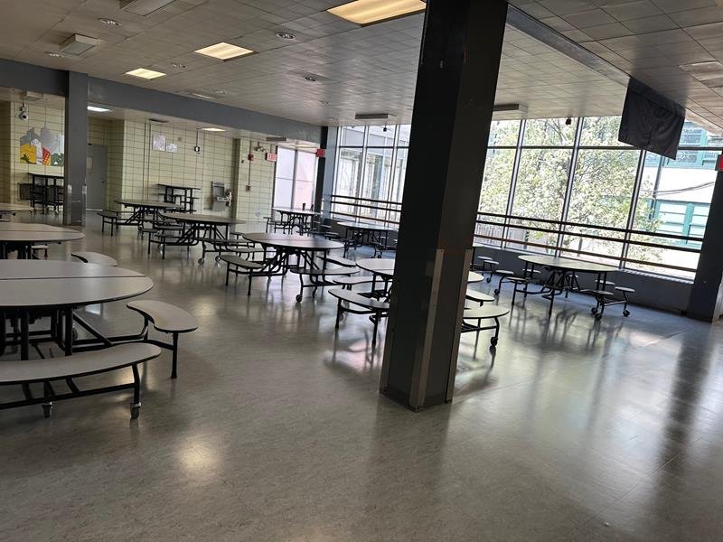 Cafeteria seating area along a window wall